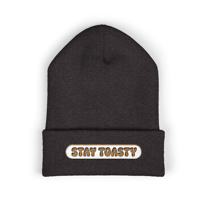 Black beanie with 'Stay Toasty' text on a white background