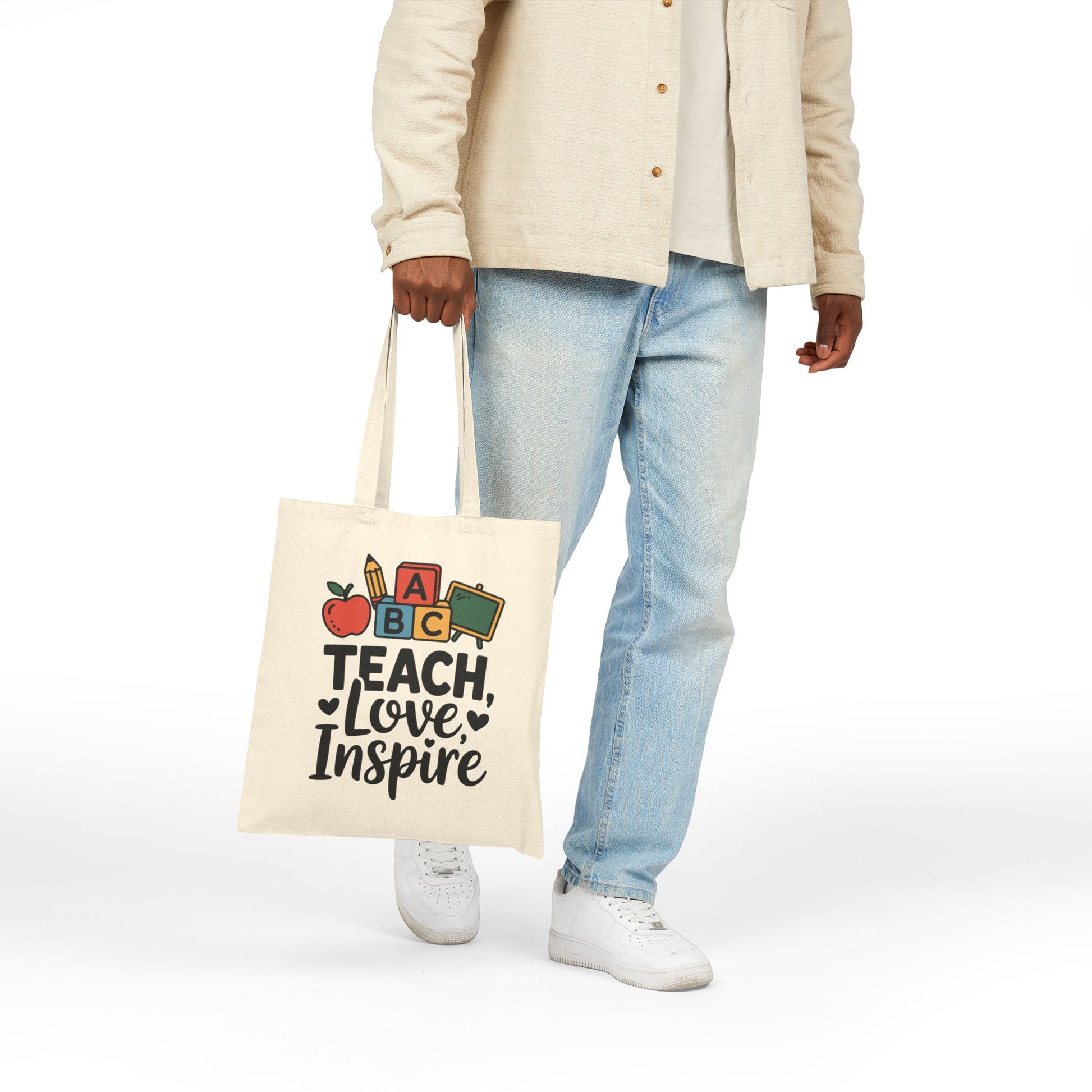 Education-themed Teach Love Inspire graphic with ABC blocks on a TEEZOCA tote bag