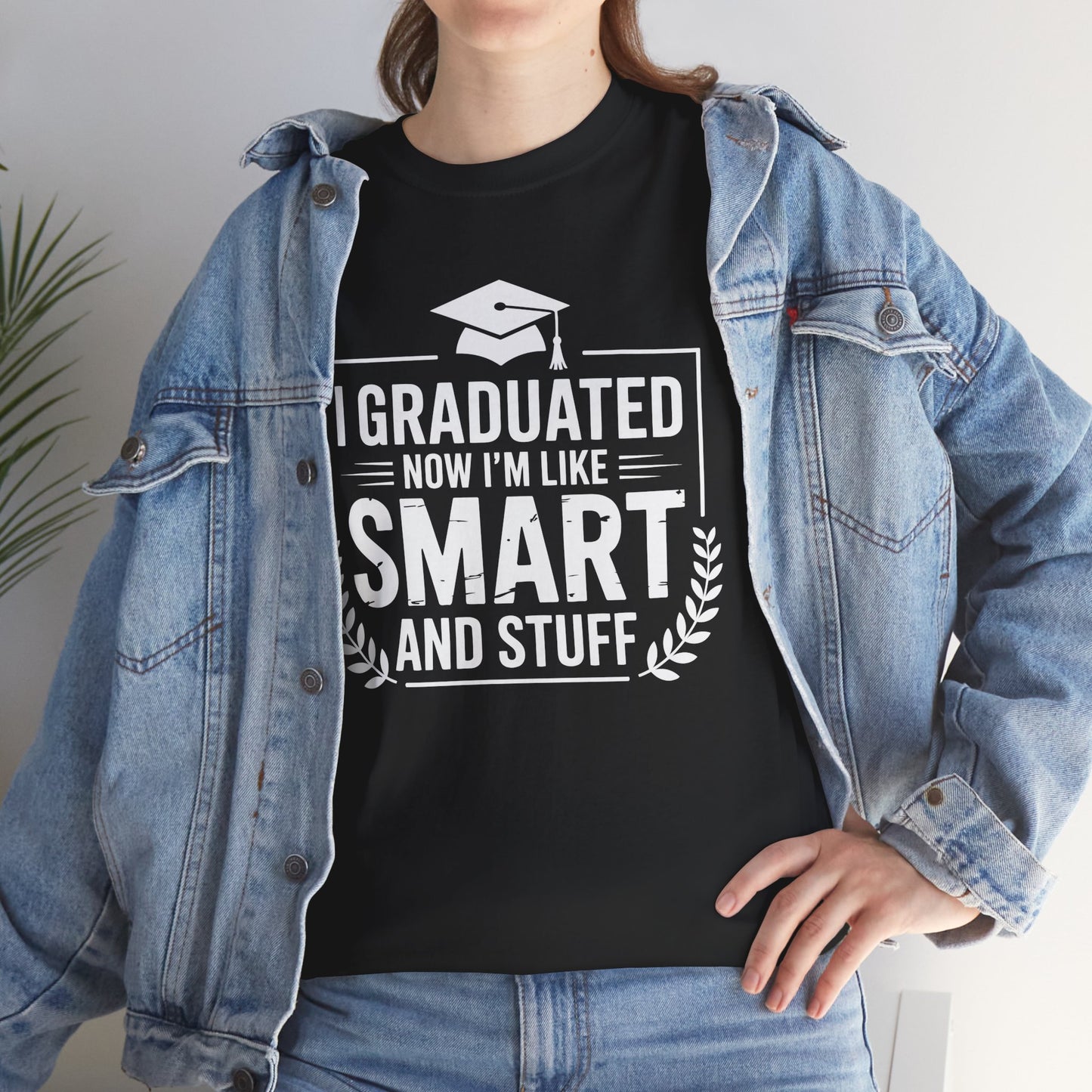 Woman in a denim jacket styling a black TEEZOCA sarcastic smart and stuff grad tee.