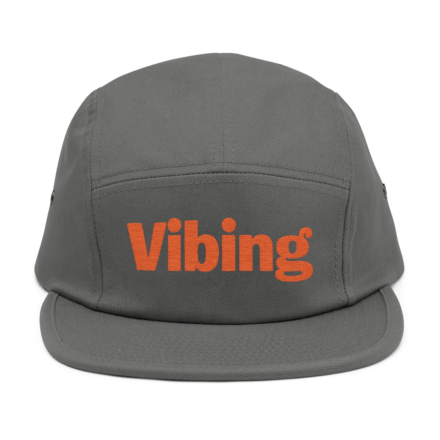 Gray cap with 'Vibing' text in orange on a white background. Close-up of “Vibing” premium embroidery for streetwear style. TEEZOCA