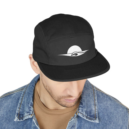 Black cap with a logo worn by a person on a white background. Minimal sunset and wave outline embroidered on a 5-panel cap by TEEZOCA