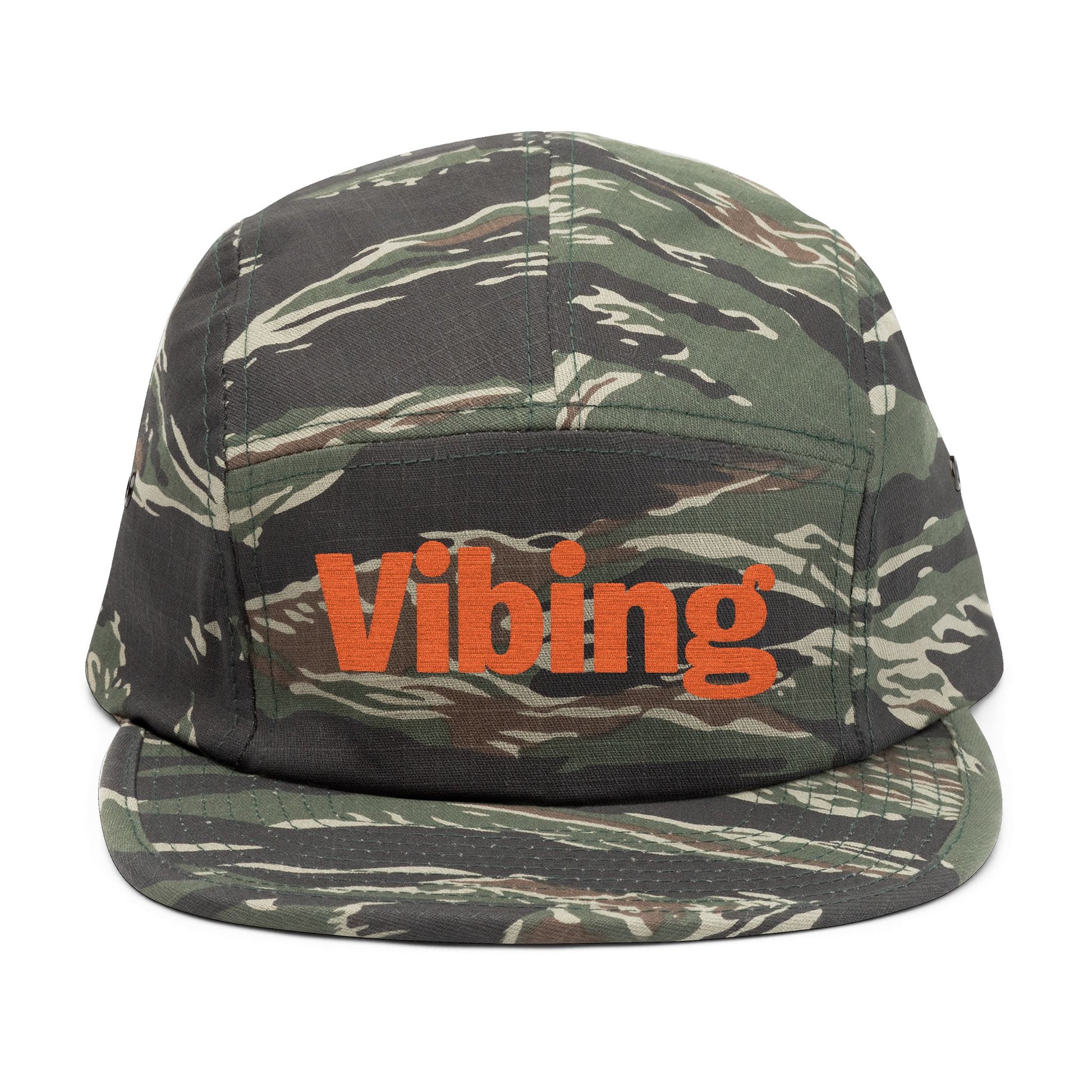 Camouflage cap with 'Vibing' text on a white background. Close-up of “Vibing” premium embroidery for streetwear style. TEEZOCA