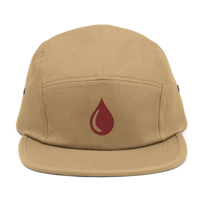 Beige cap with a red droplet symbol on a white background. Minimal coffee drop icon embroidered in a clean, modern style 5-panel cap. TEEZOCA