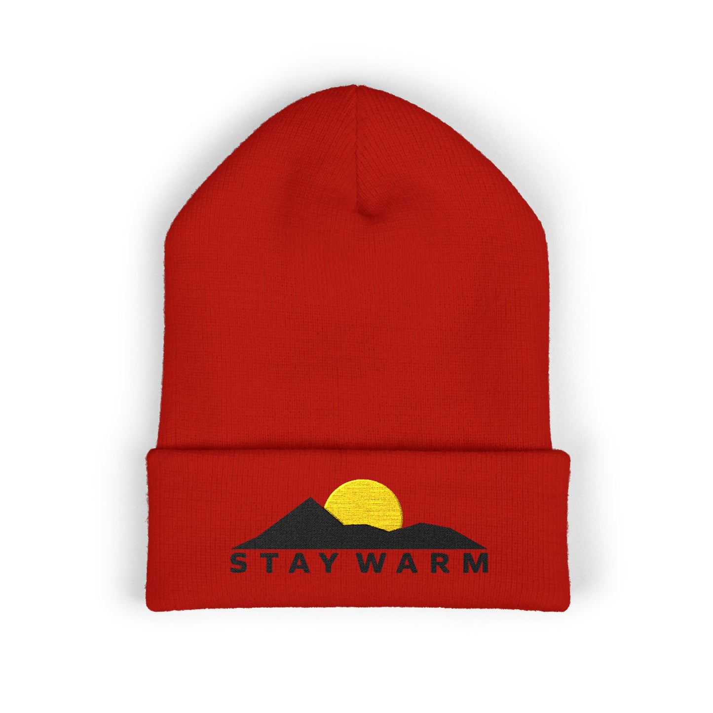 Red beanie with mountain and sun design and 'Stay Warm' text on a white background