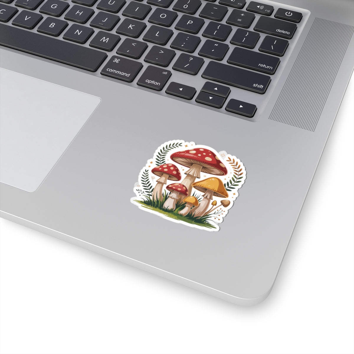 Laptop with a sticker of mushrooms on the palm rest area. TEEZOCA