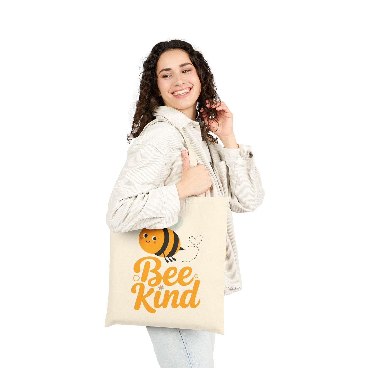 Positive quote Bee Kind displayed with a playful bee graphic on a TEEZOCA tote bag