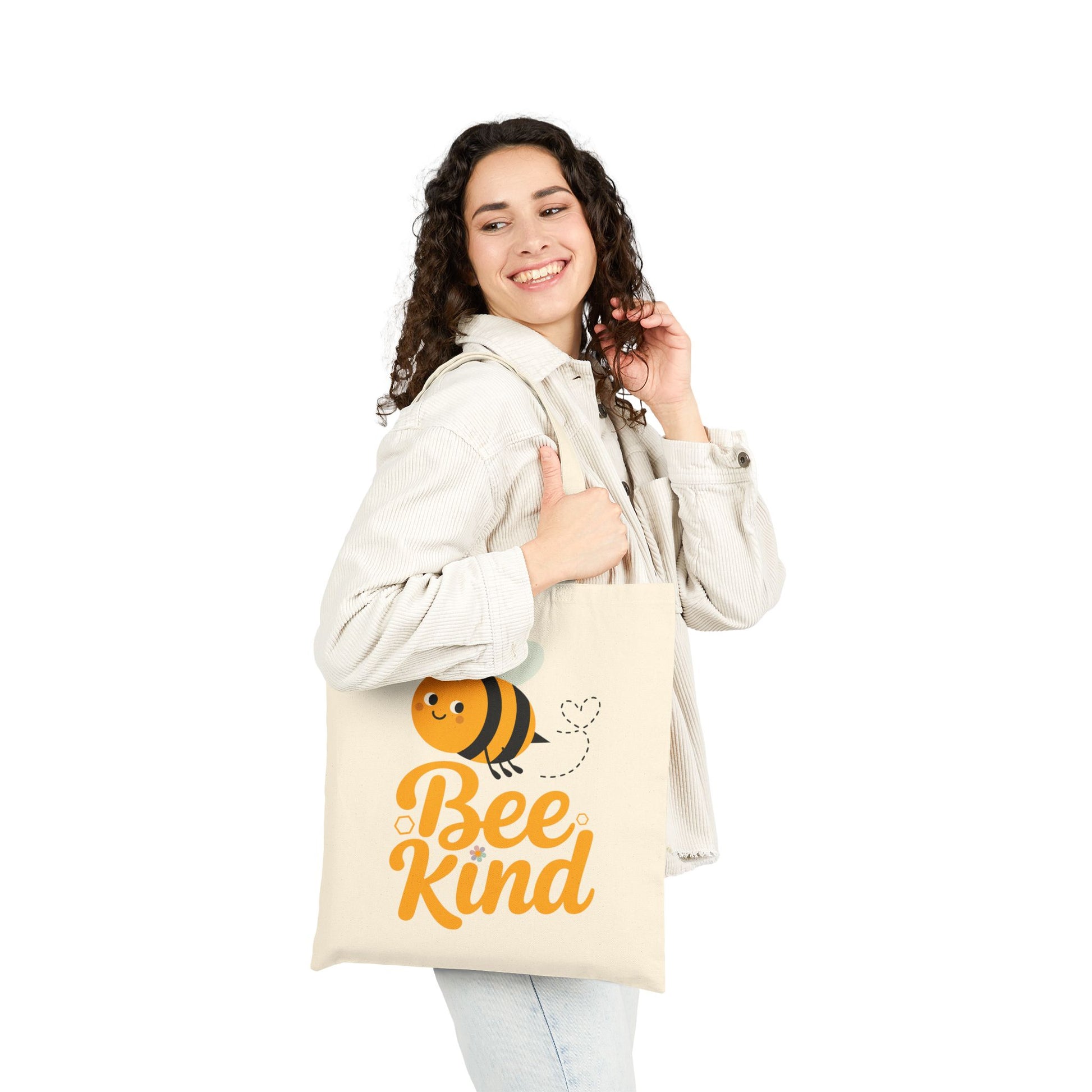 Positive quote Bee Kind displayed with a playful bee graphic on a TEEZOCA tote bag