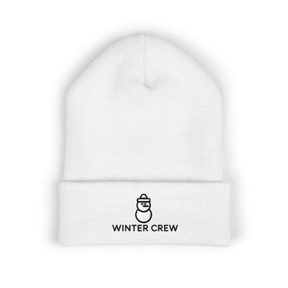 White beanie with 'Winter Crew' logo on a white background. Embroidered Winter Crew beanie with minimalist snowman icon on the cuff