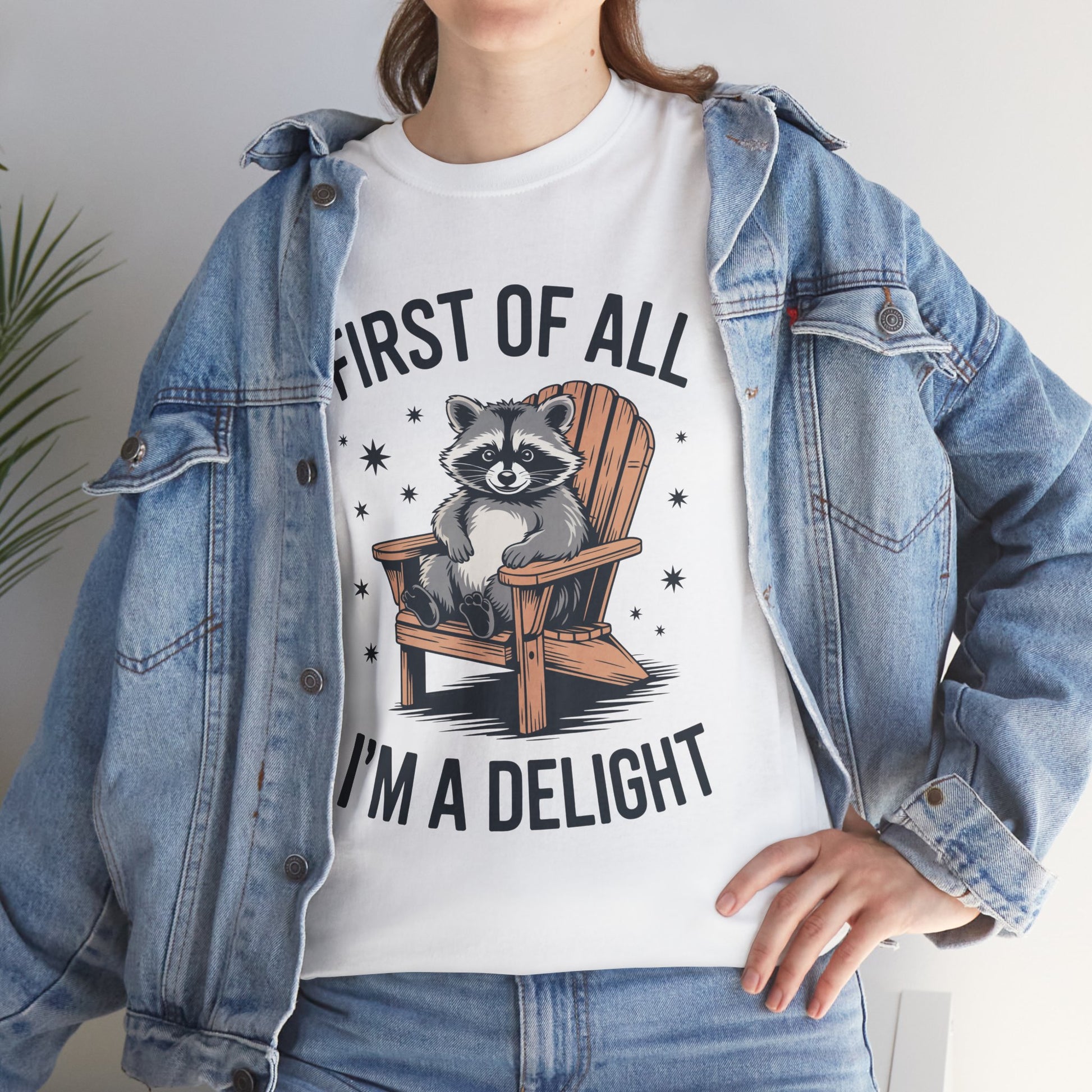 Woman in a denim jacket layering a TEEZOCA “First Of All I’m A Delight” funny raccoon shirt.