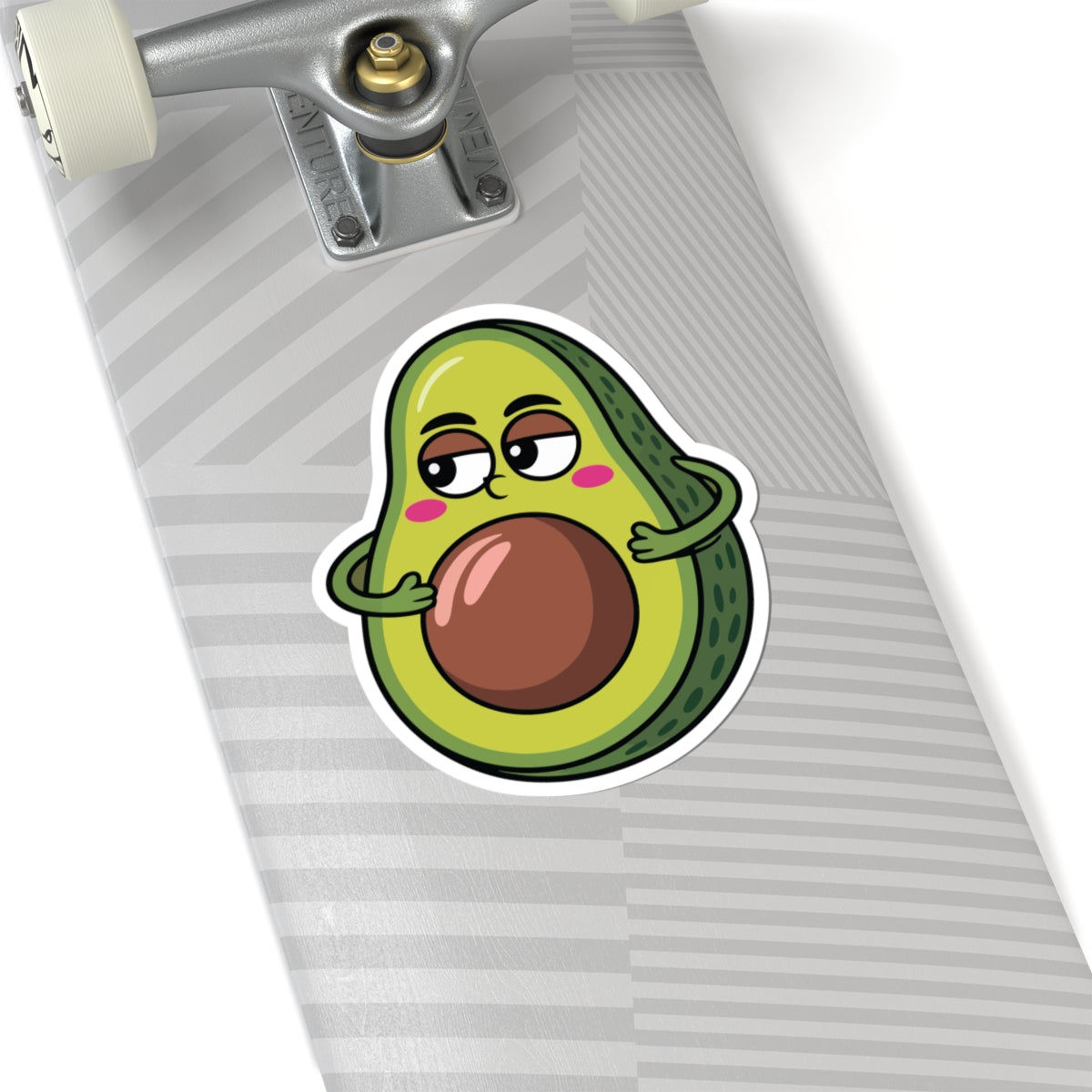 Skateboard with a cartoon avocado sticker on a white background. TEEZOCA