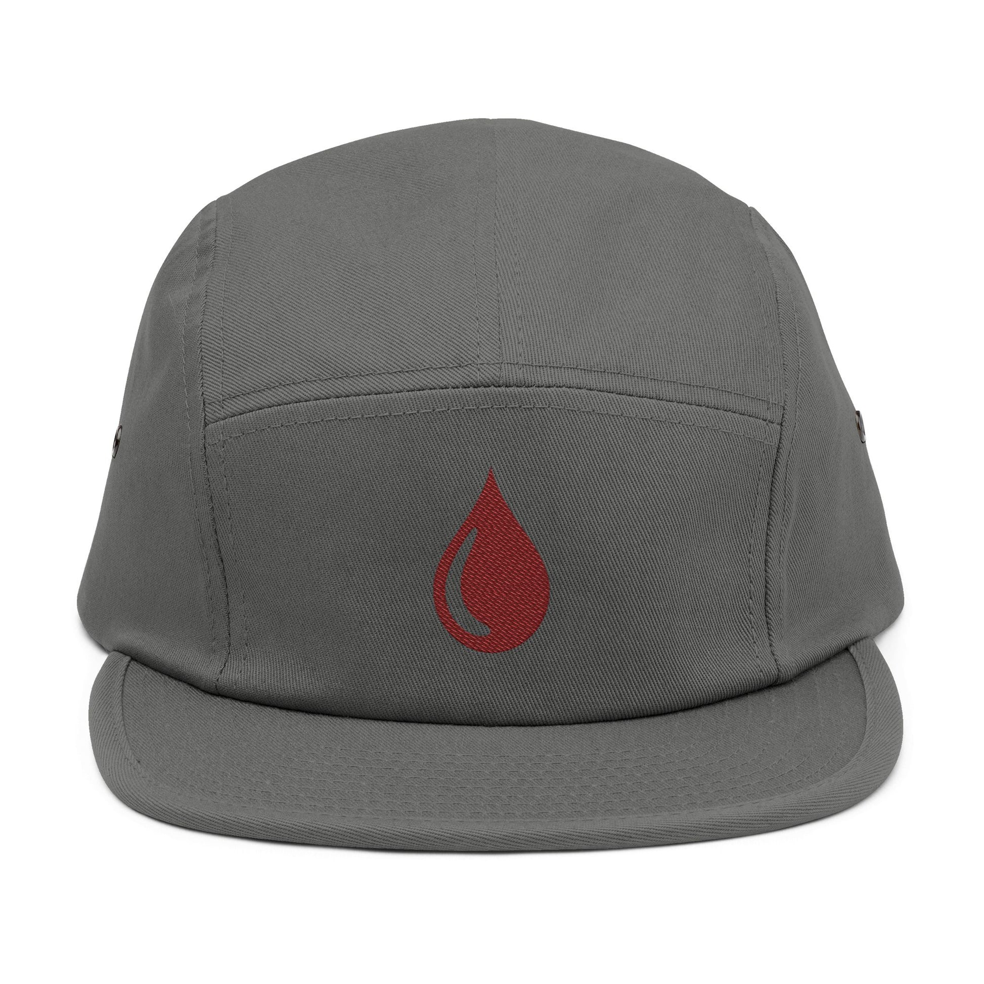 Gray cap with a red droplet symbol on a white background. Minimal coffee drop icon embroidered in a clean, modern style 5-panel cap. TEEZOCA