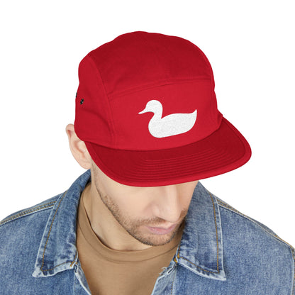 Red cap with a white duck logo worn by a person on a white background. Minimal duck silhouette embroidered on 5-panel cap by TEEZOCA