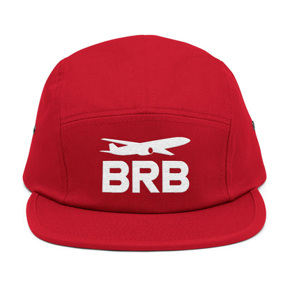 Red cap with 'BRB' and airplane logo on a white background. Minimalist BRB airplane embroidered design for 5-panel cap by TEEZOCA