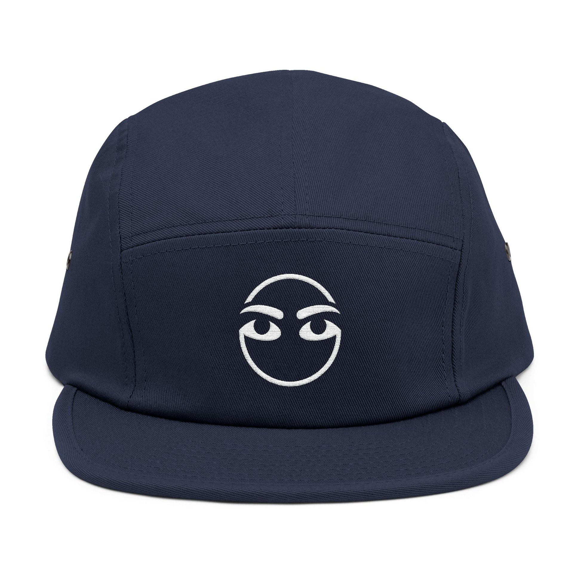 Navy blue cap with a white logo on a white background. Raised brow face minimalist embroidery design in white. TEEZOCA