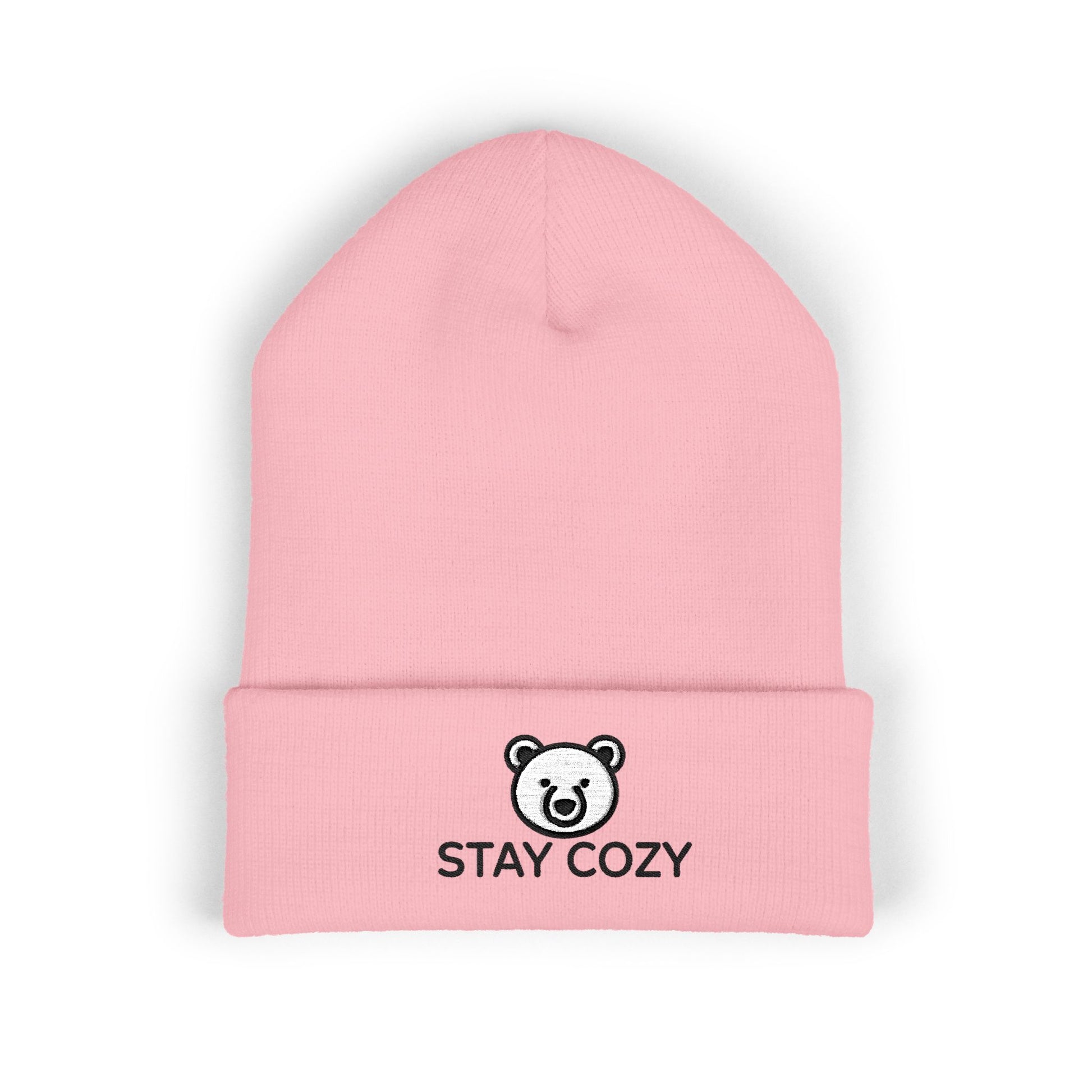 Pink beanie with 'Stay Cozy' text and bear logo on a white background