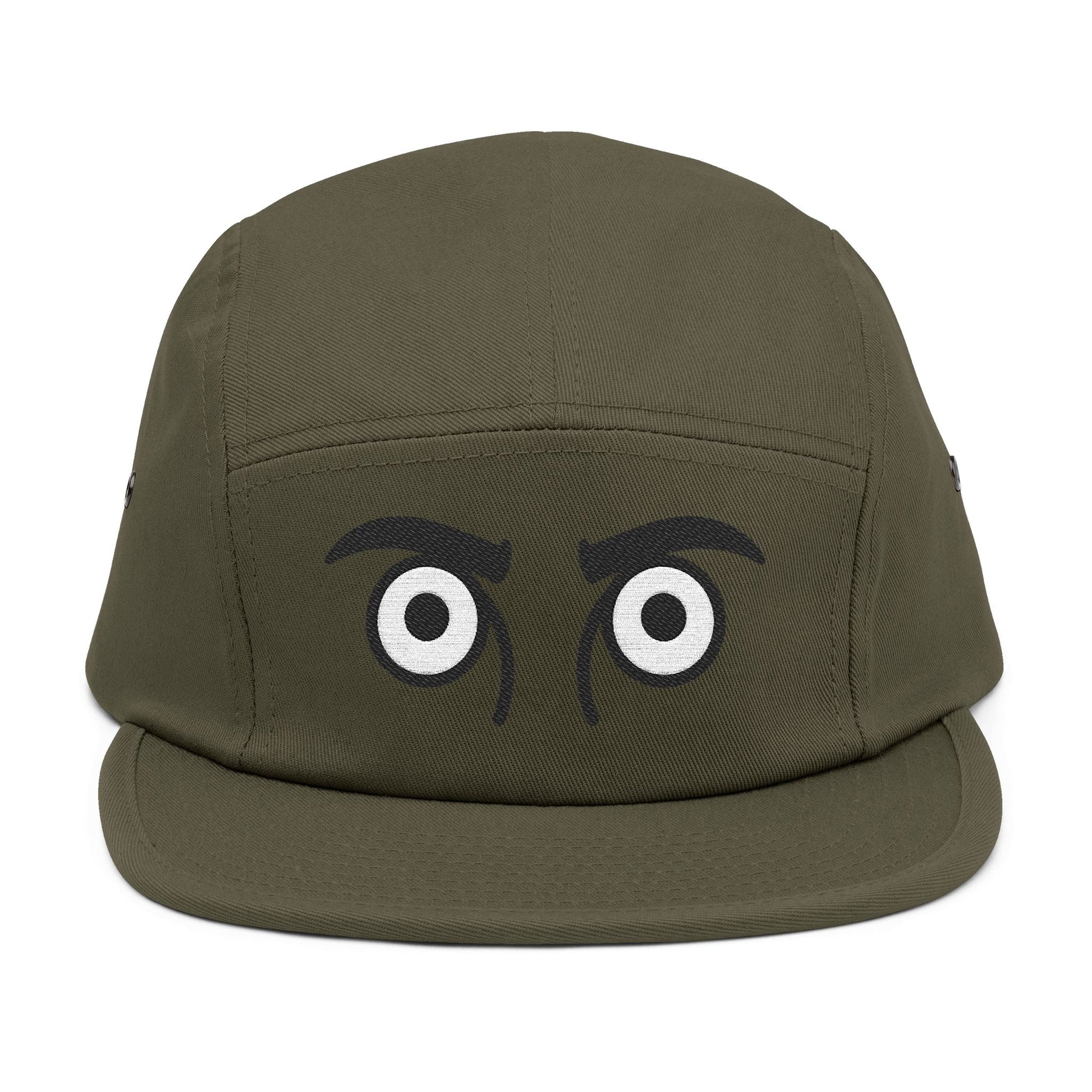 Green cap with cartoonish eyes on a white background. TEEZOCA