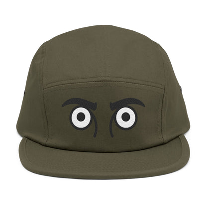 Green cap with cartoonish eyes on a white background. TEEZOCA
