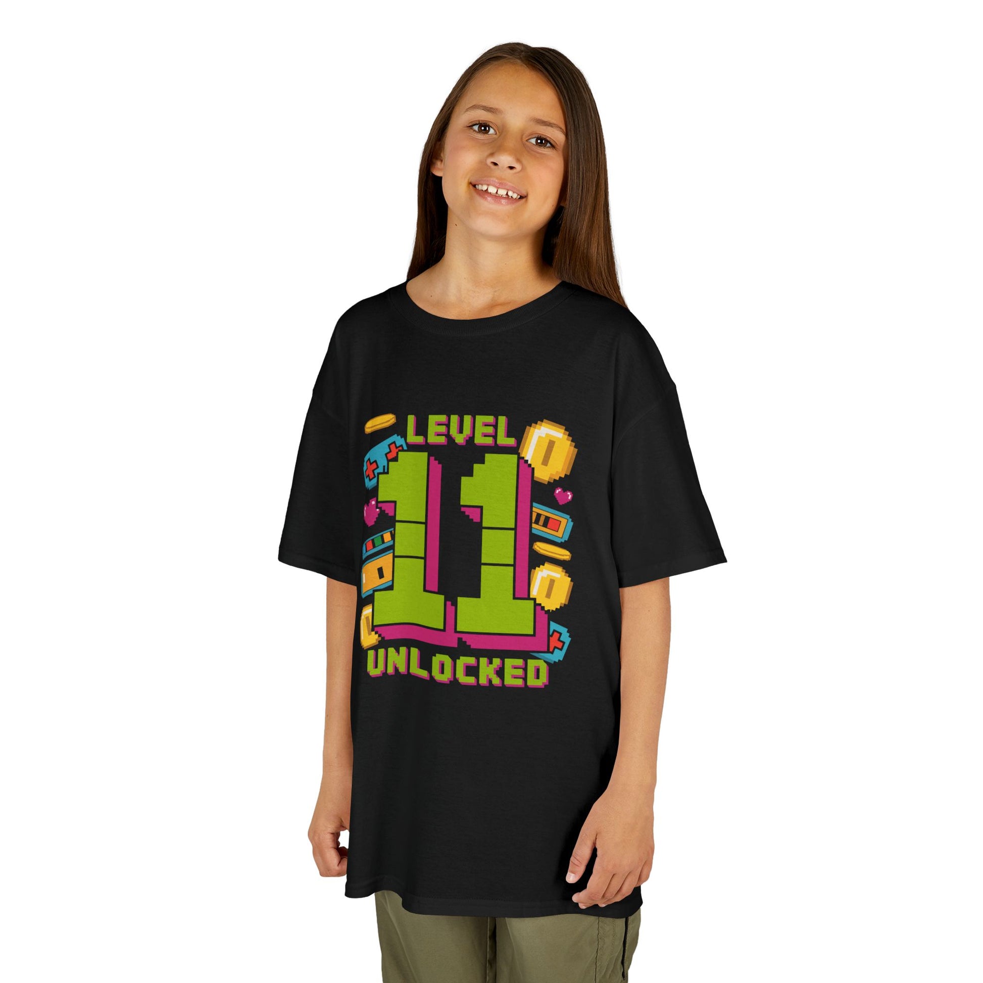 Child wearing a black t-shirt with colorful text design on a white background
