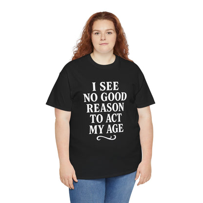 “Woman wearing black ‘I See No Good Reason To Act My Age’ humor tee, casual outfit, front view.”


