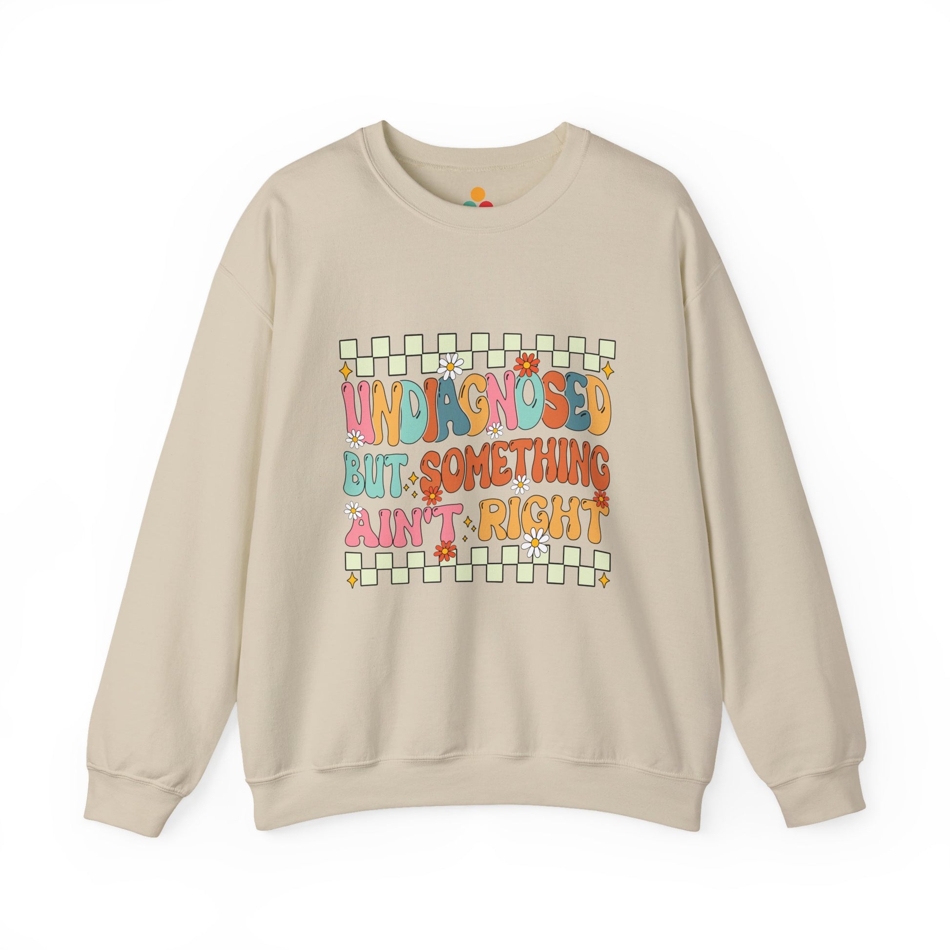 Beige sweatshirt with colorful text design on a white background