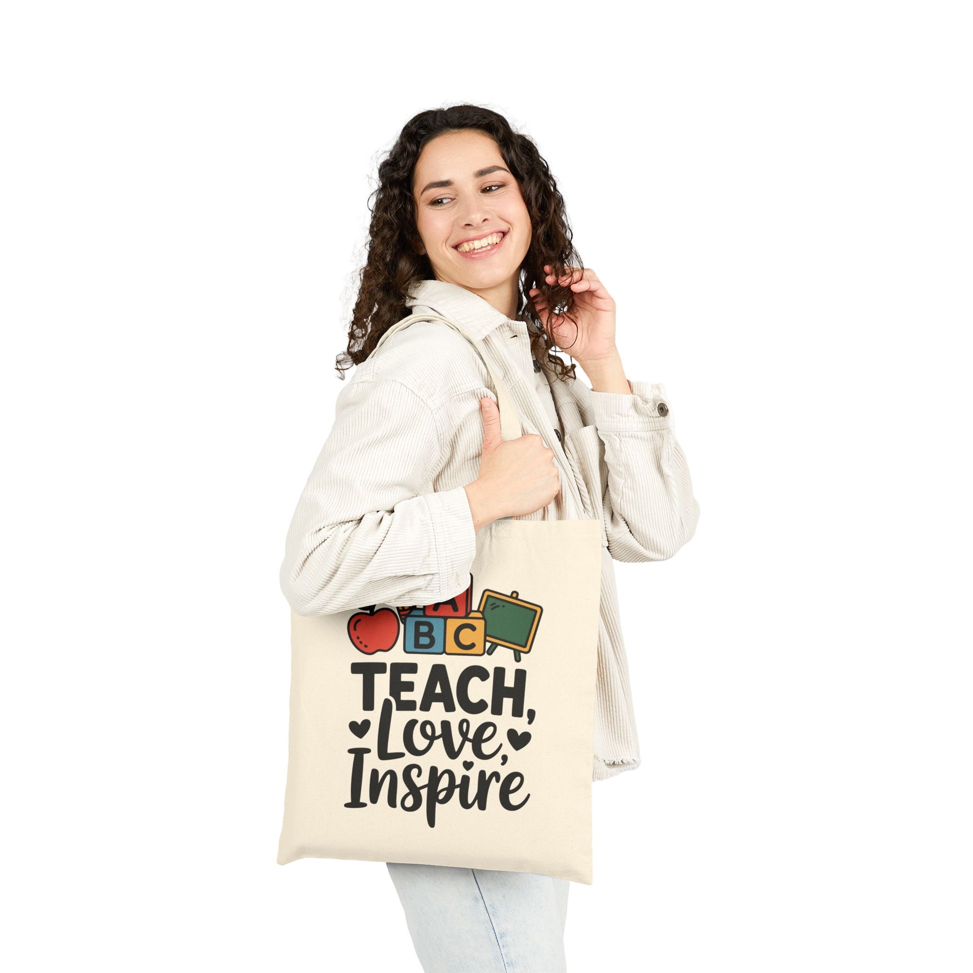 Education-themed Teach Love Inspire graphic with ABC blocks on a TEEZOCA tote bag