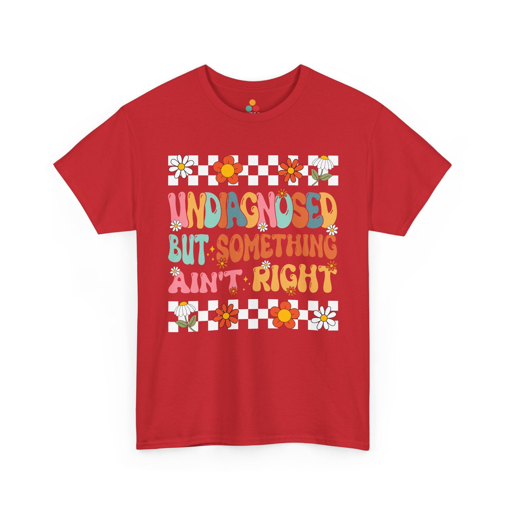 Red t-shirt with colorful text and floral patterns on a white background