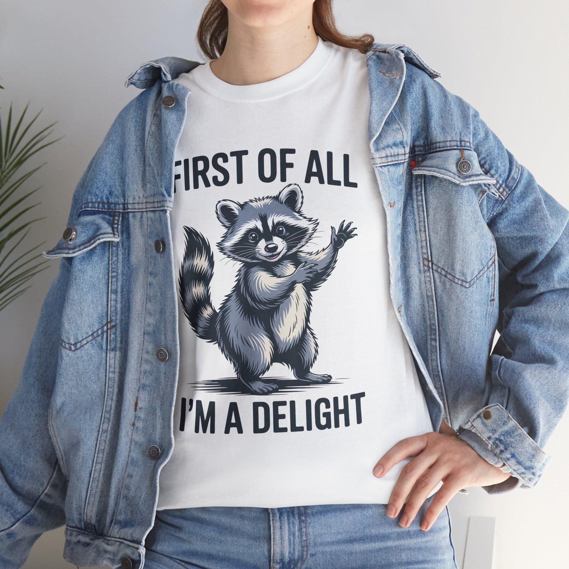 Woman in a denim jacket layering a TEEZOCA “First Of All I’m A Delight” funny t‑shirt.
