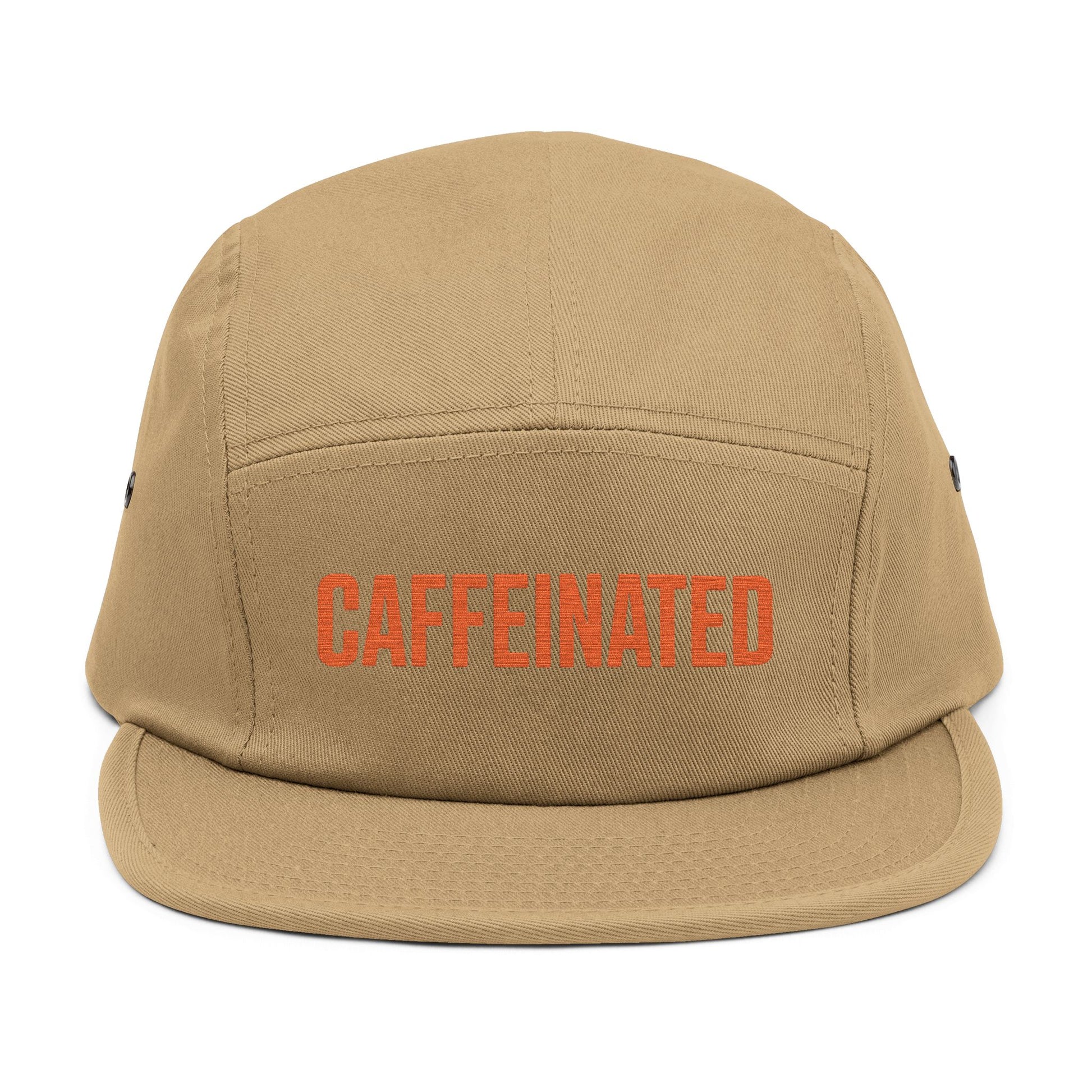 Beige cap with 'CAFFEINATED' text in red on a white background. Caffeinated bold typography graphic design in orange. TEEZOCA