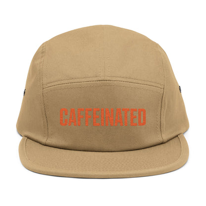 Beige cap with 'CAFFEINATED' text in red on a white background. Caffeinated bold typography graphic design in orange. TEEZOCA