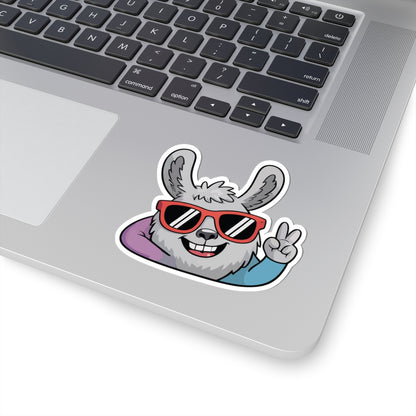 Laptop with a sticker of a cartoon llama wearing sunglasses and giving a peace sign. TEEZOCA