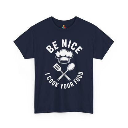 “Teezoca Be Nice I Cook Your Food t-shirt, bold white restaurant humor text, navy blue tee, front view.”

