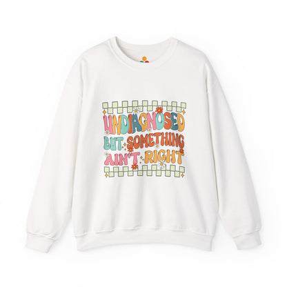 White sweatshirt with colorful text design on a white background
