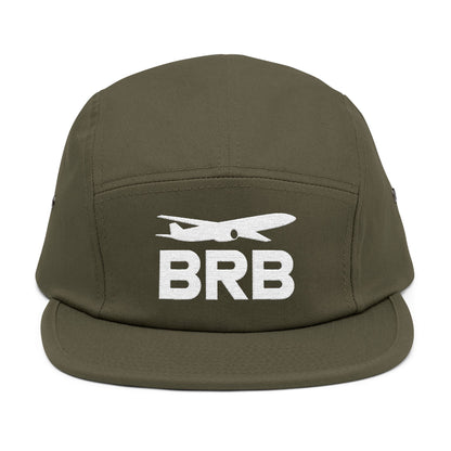 Green cap with 'BRB' and airplane icon on a white background. Minimalist BRB airplane embroidered design for 5-panel cap by TEEZOCA