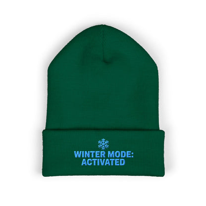 Green beanie with 'Winter Mode: Activated' text on a white background. Blue snowflake winter beanie with ‘Winter Mode Activated’ text embroidery
