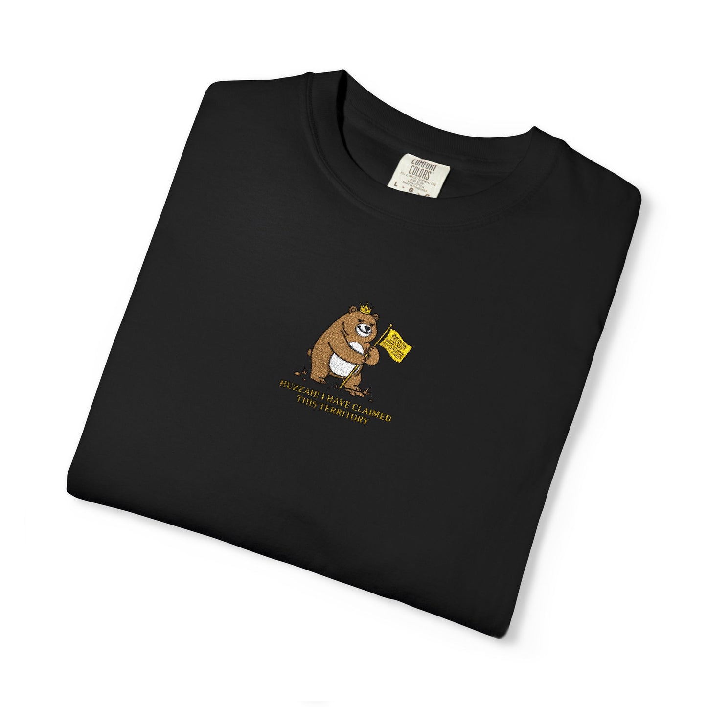 Close-up of a Comfort Colors® Black shirt featuring an embroidered grumpy bear holding a "Do Not Enter" flag with the saying "Huzzah! I Have Claimed This Territory.

