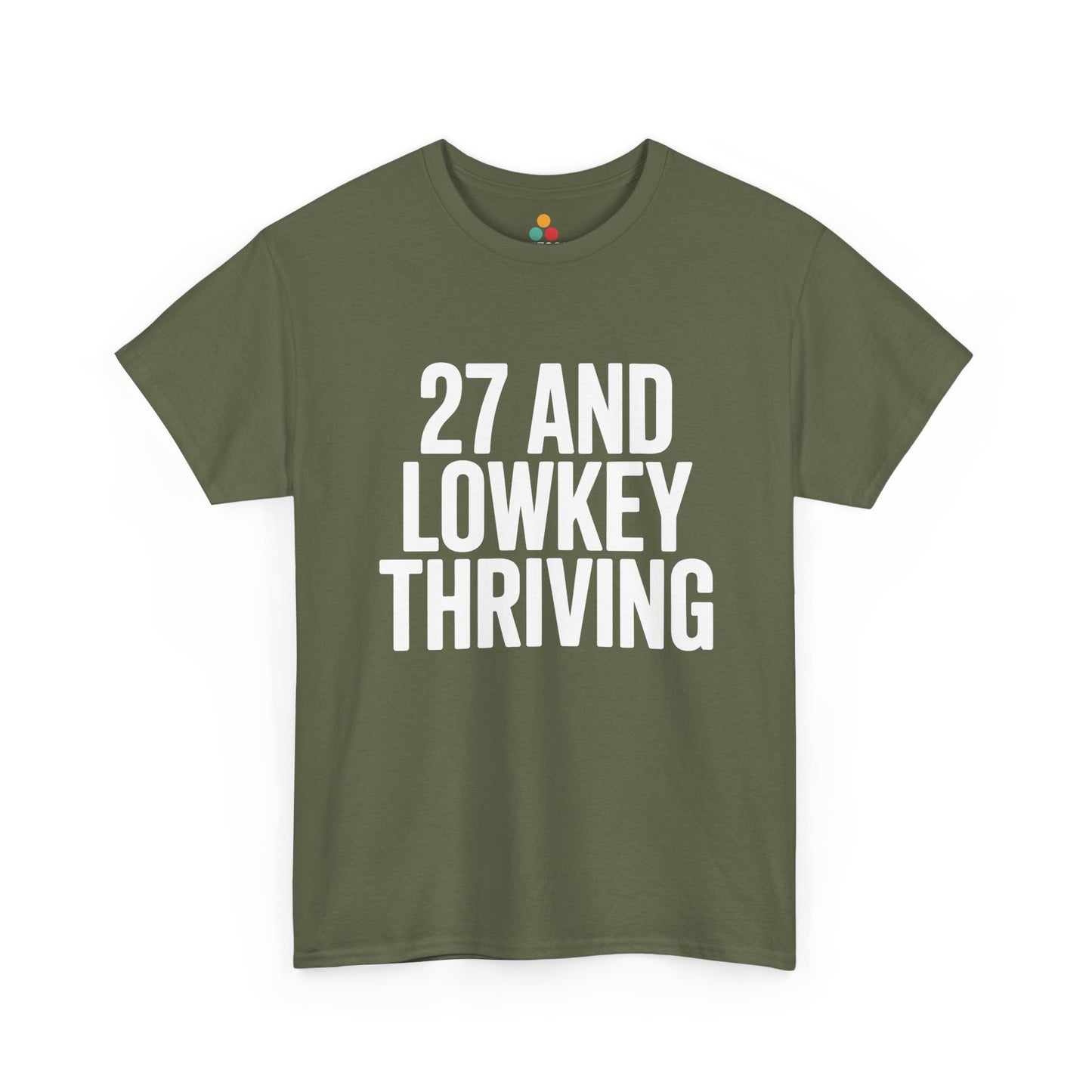 Green t-shirt with white text '27 AND LOWKEY THRIVING' on a white background