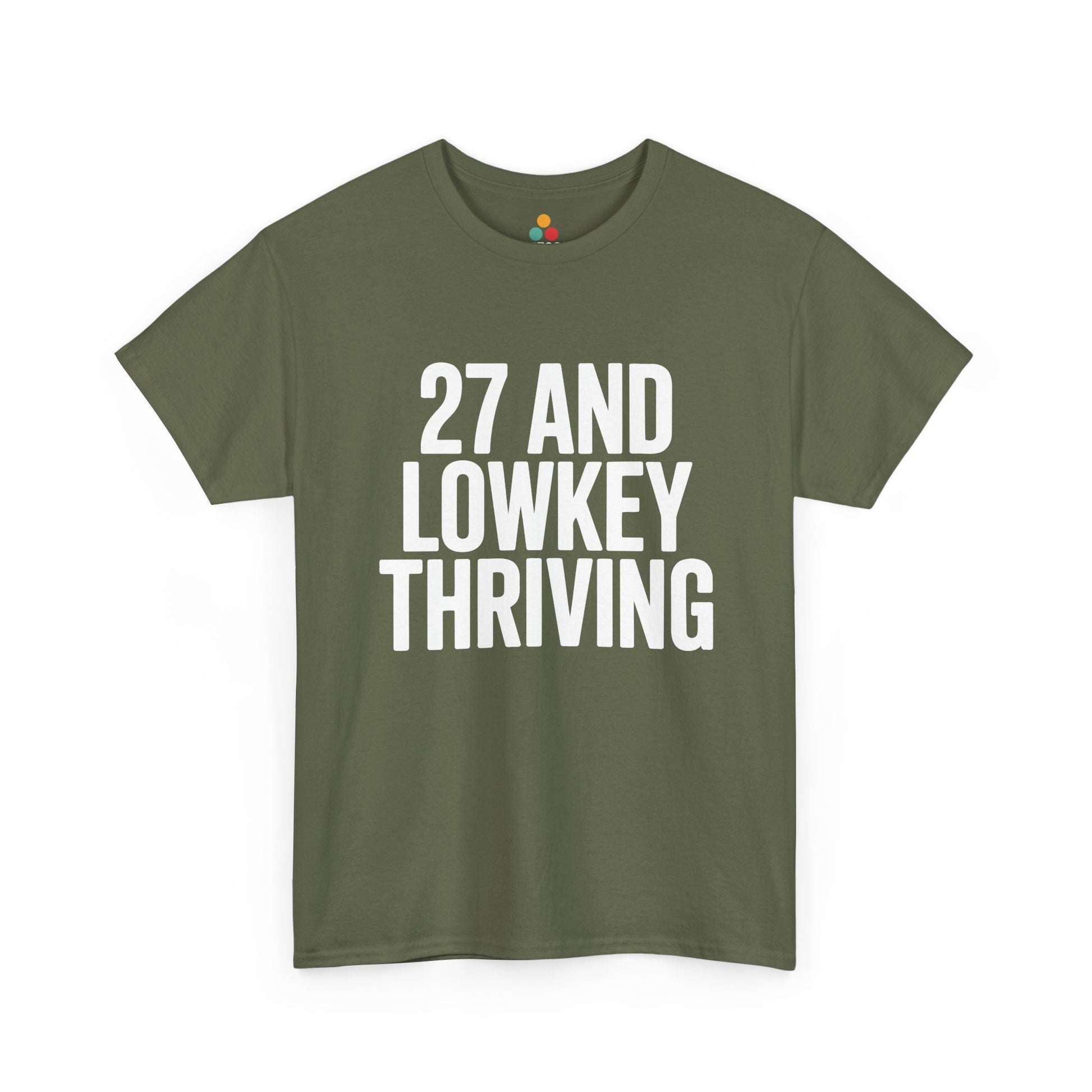 Green t-shirt with white text '27 AND LOWKEY THRIVING' on a white background