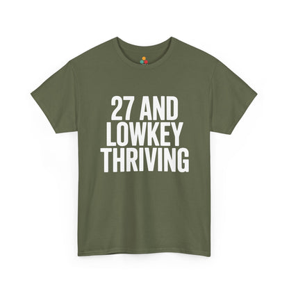 Green t-shirt with white text '27 AND LOWKEY THRIVING' on a white background