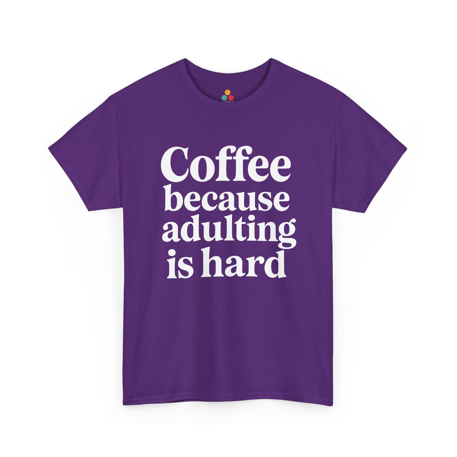 “Teezoca Coffee Because Adulting Is Hard t-shirt, bold white funny saying, purple tee, front view.”