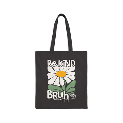 Black tote bag with a white daisy and text 'Be Kind Bruh' on a white background