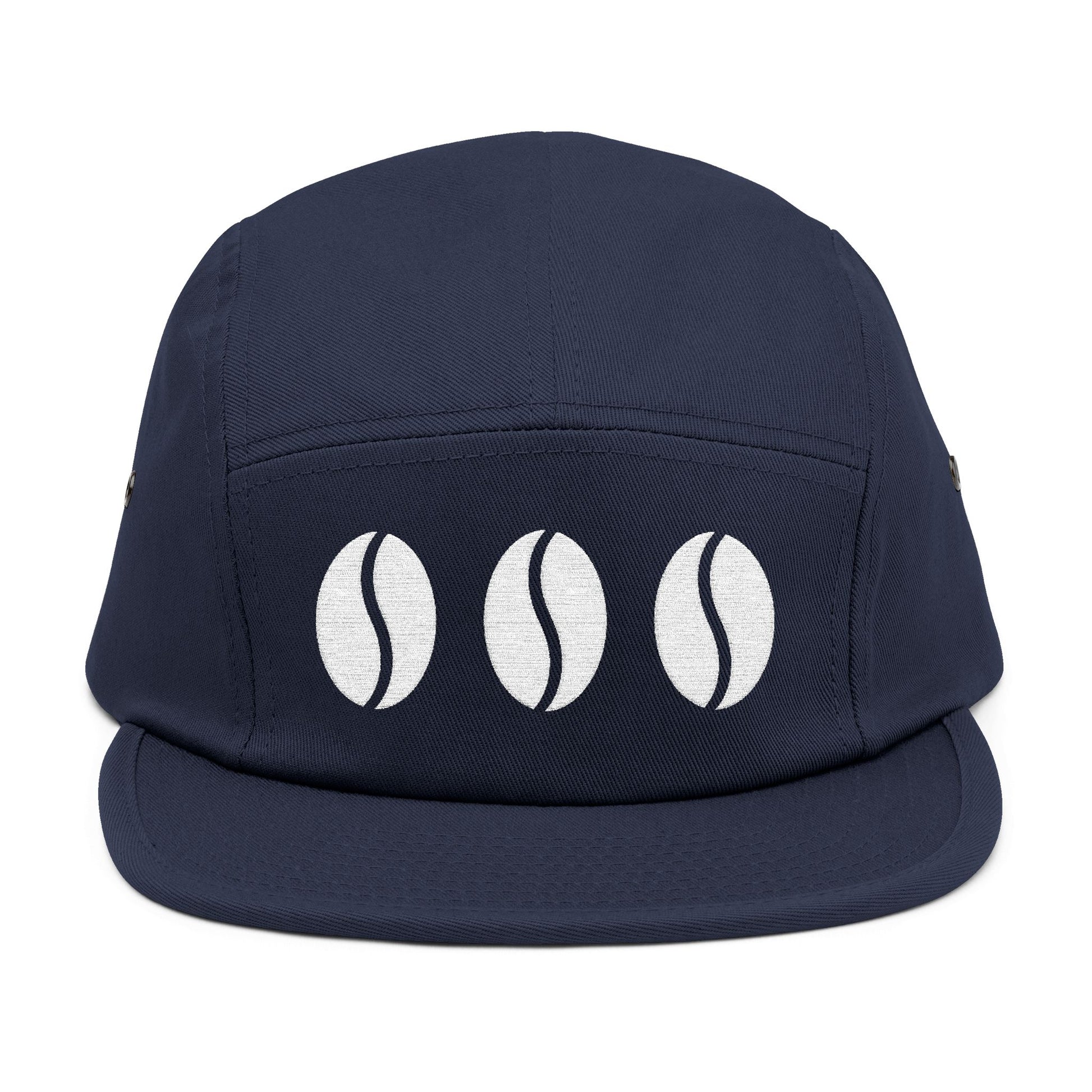 Navy blue cap with three white coffee bean icons on a white background. Triple coffee bean minimalist embroidery on 5-panel cap. TEEZOCA