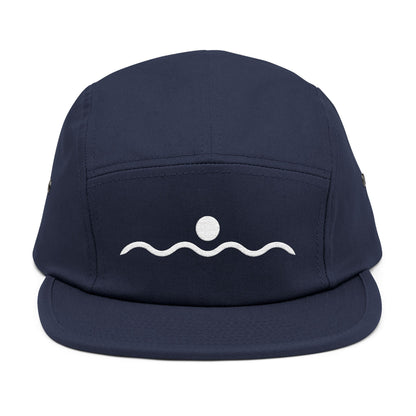 Navy blue cap with white wave and circle design on a white background. Minimal sunset and wave line-art graphic in white. TEEZOCA
