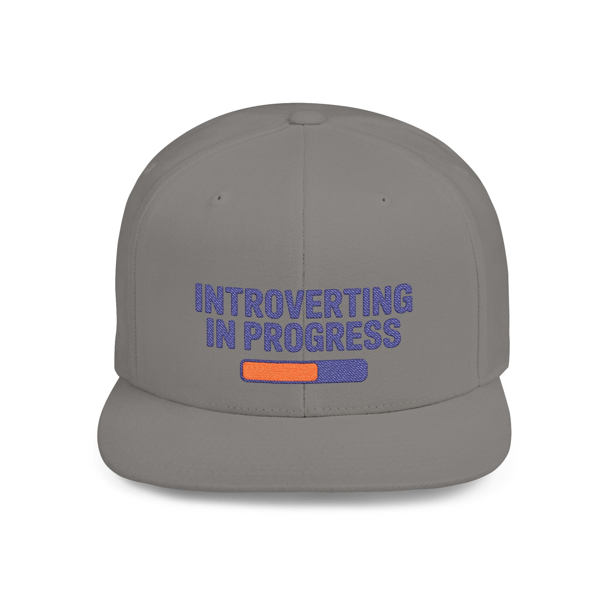 Gray cap with 'Introverting in Progress' text on a white background