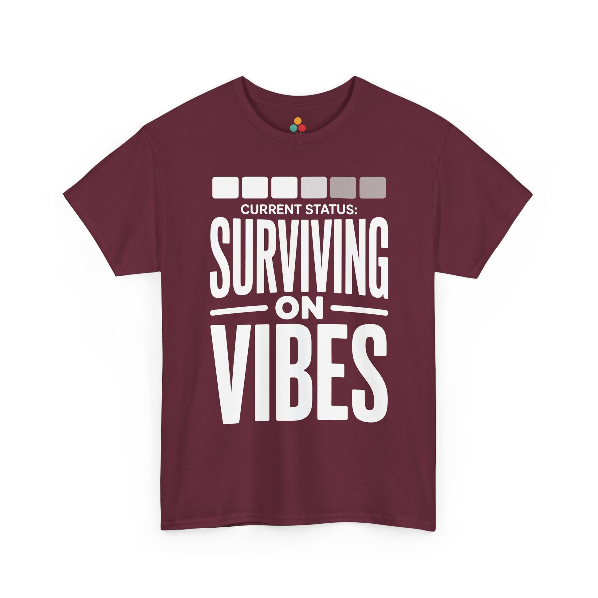 Maroon t-shirt with 'Current Status: Surviving on Vibes' text on a white background | TEEZOCA