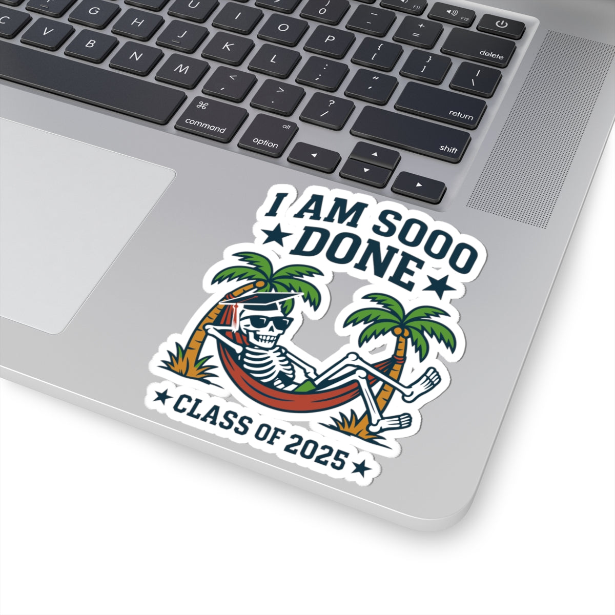Laptop with a 'I AM SOOO DONE CLASS OF 2025' sticker on the palmrest area.