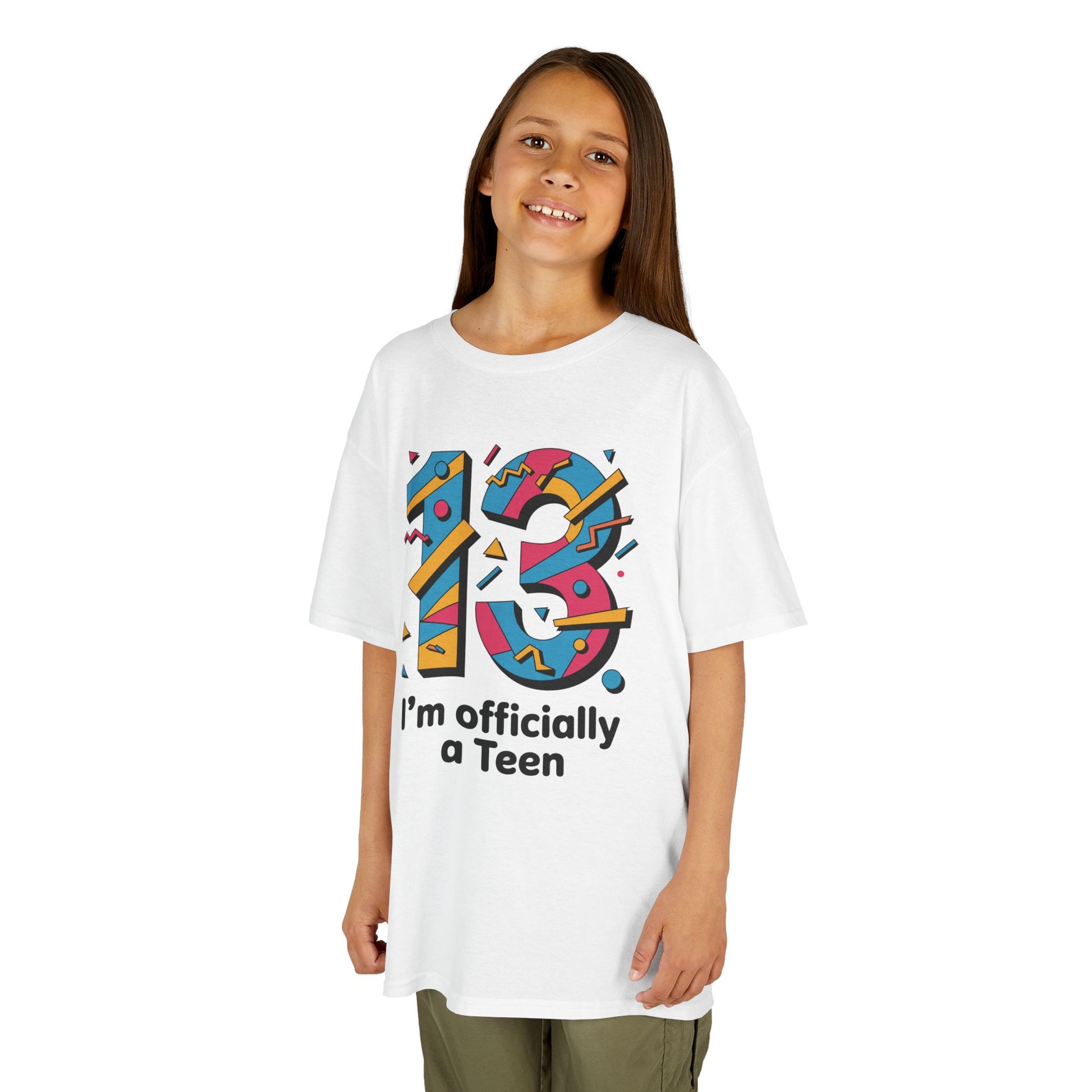 Young girl wearing a white t-shirt with colorful number 13 design and text on a white background