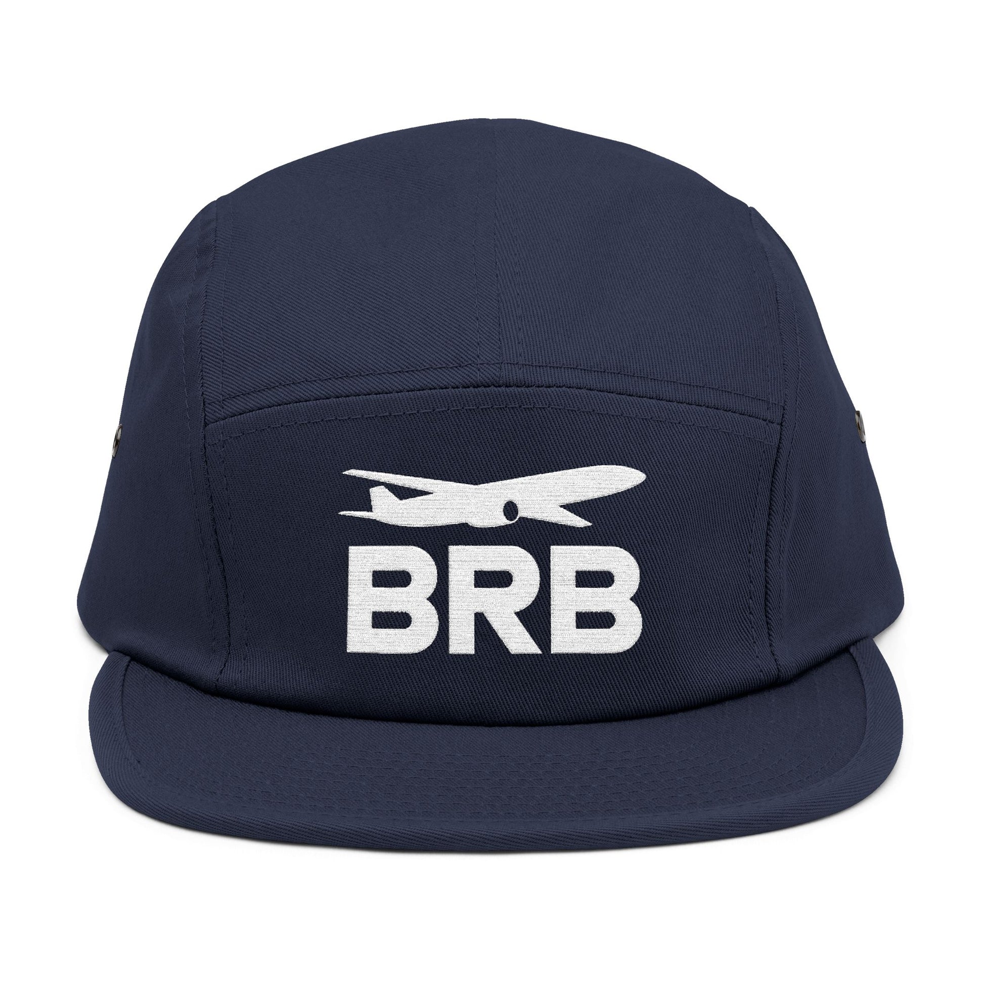 Navy blue cap with 'BRB' and airplane logo on a white background. Minimalist BRB airplane embroidered design for 5-panel cap by TEEZOCA