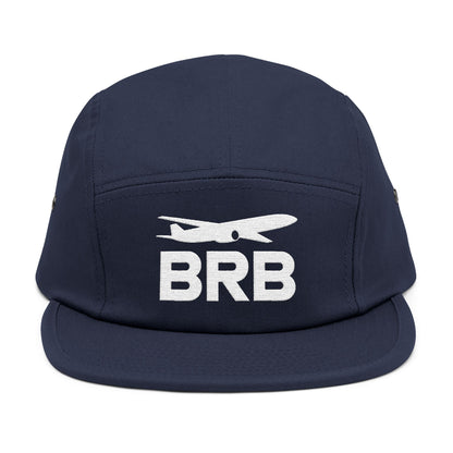 Navy blue cap with 'BRB' and airplane logo on a white background. Minimalist BRB airplane embroidered design for 5-panel cap by TEEZOCA