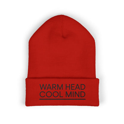 Red beanie with 'Warm Head Cool Mind' text on a white background. Black embroidered typography beanie reading Warm Head Cool Mind