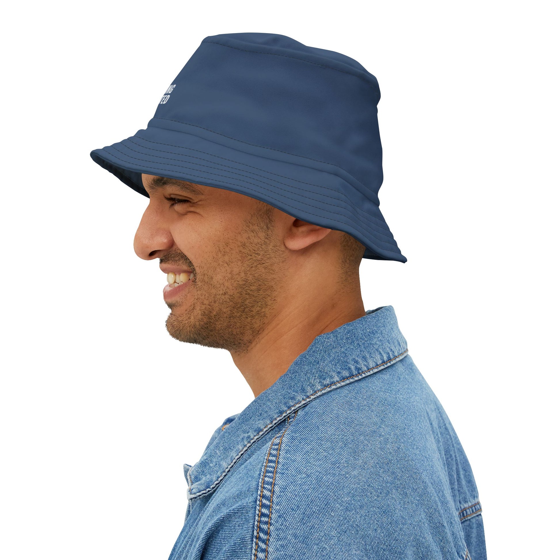 Funny navy blue bucket hat with 'Energy-Saving Mode Activated' text on a white background. TEEZOCA